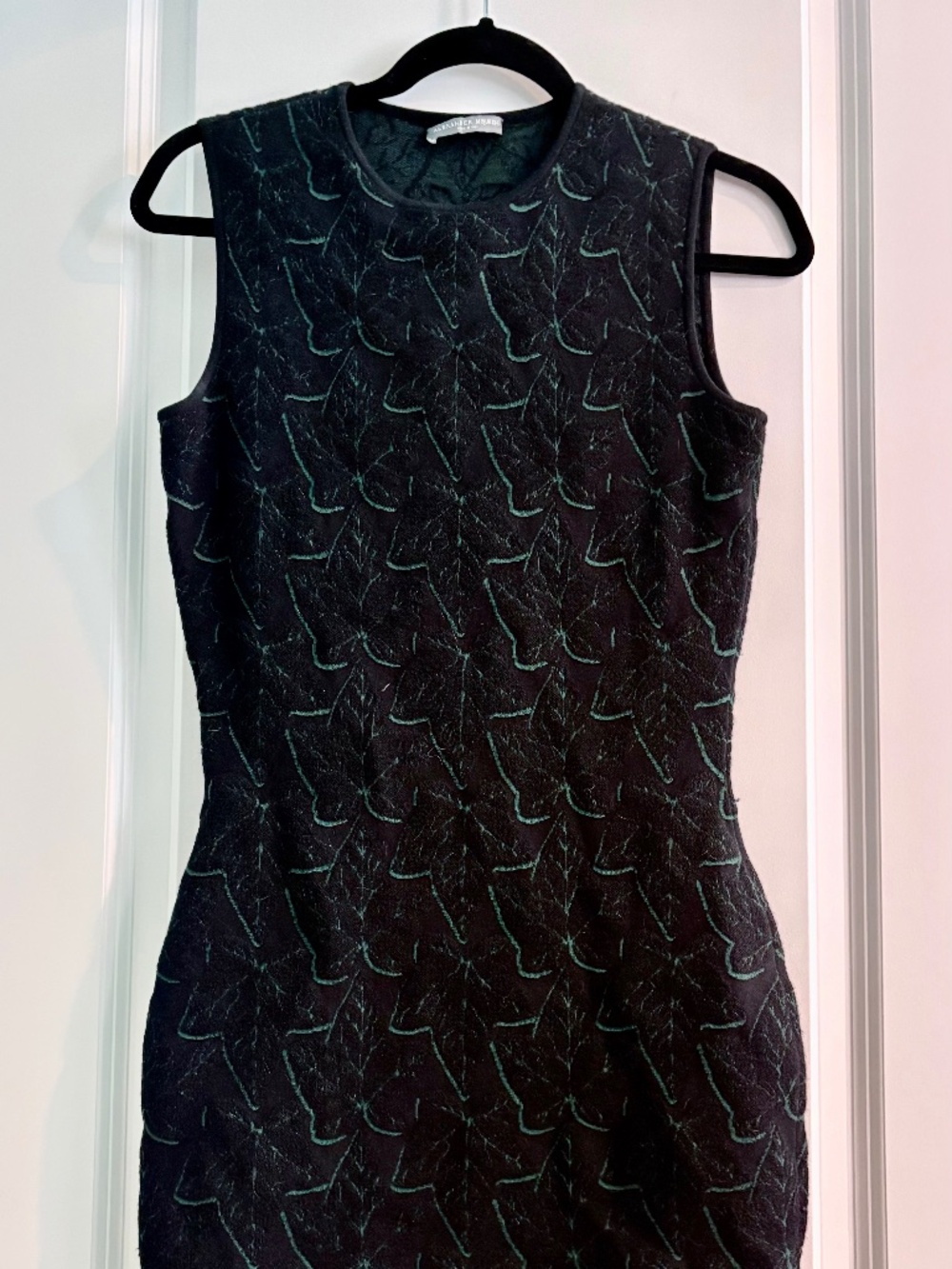 Alexander McQueen. Black Sleeveless Fitted Knit Dress with Green Leaf Pattern